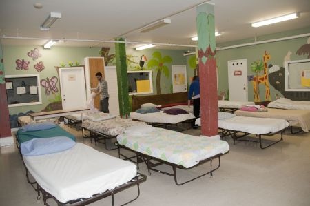 Volunteers prepare for another night at the shelter. "The elephant in the room is that there has been no government funding of this project," says shelter organizer Fiona Traynor.  photo: Baran shirazi