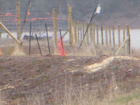 This fence went up in the weekend days before Minister Miller announced the dismissal of the appeals. The fence runs over the dike and on to the land that is usually Crown property. Photo credit: Dennis Levandier.