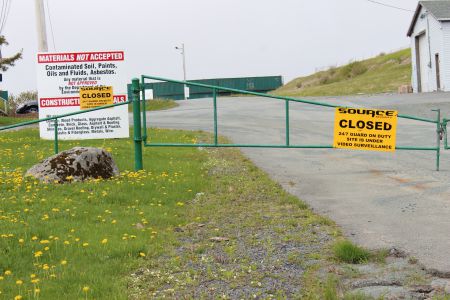 RDM Recycling, at 1275 Old Sambro Road, has been closed since 2013. Since then, nothing has been done to clean up the site or help the residents with their contaminated lakes and drinking water supply. [Photo: R. Hussman]