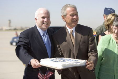The arrestables: John McCain and fellow war criminal George Bush. [Photo: Anika Malone]