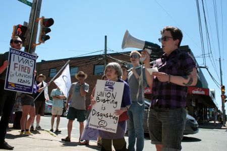 Jude Kinder speaks at the rally on Saturday. (Photo by Hilary Beaumont)
