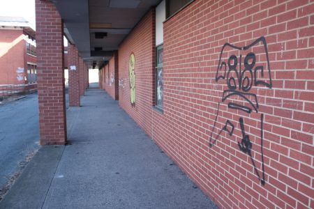 Graffiti on the back wall of the school. (Photo by Hilary Beaumont)