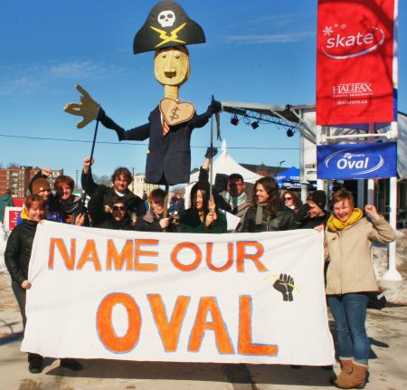 Members of Solidarity Halifax with an effigy of Emera CEO Chris Huskilson lurking in the background (Photo: Miles Howe).