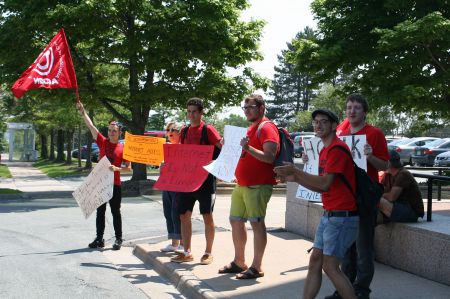 This day and age internet access should not be restricted to people who can afford its high costs, say members of Nova Scotia ACORN. They rallied at the CRTC office on Wyse Road in Dartmouth. The CRTC is studying the issue. Photo Robert Devet 