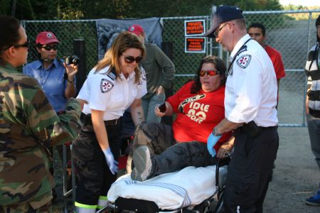 Lorraine Clair receives medical attention after being struck by RCMP cruiser. [Photo: Miles Howe]