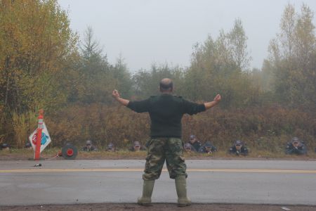 Far from the Mi'kmaq's last stand. District War Chief Jason Augustine faces down the barrels of 20 pistols. [Photo: Miles Howe]