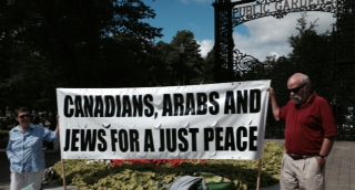 This sign attracted many people who signed the letters to PM Harper