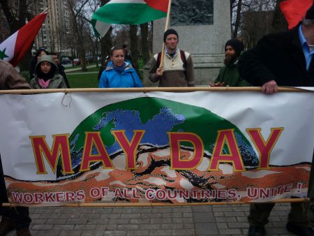 May Day – International Workers’ Day – was celebrated in Halifax, across Canada, and around the world. The May Day banner, portraying a firm handshake in front of the globe, proclaims “Workers of the World, Unite!”
