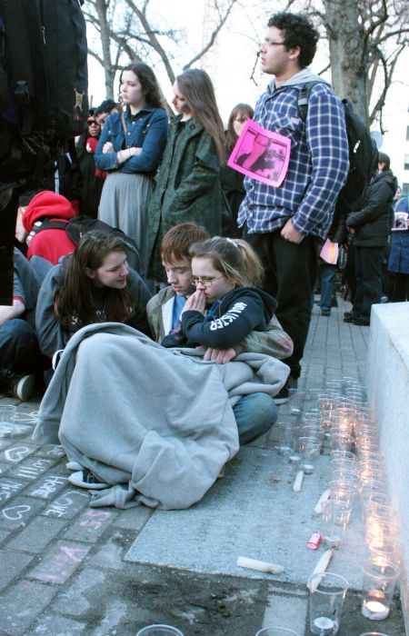 Young people comfort each other during the vigil. (Photo by Hilary Beaumont)