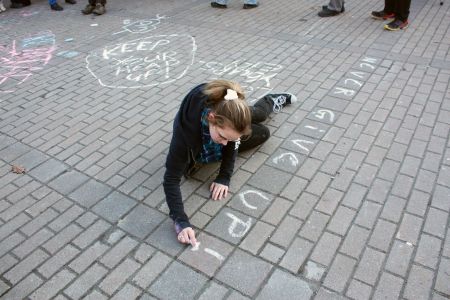 A young person writes a message of hope. (Photo by Hilary Beaumont)