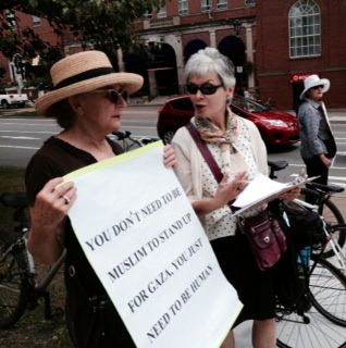 Carrying signs today in front of the Public Gardens
