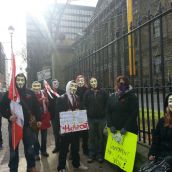 Some of the more than 50 protesters who marched from Province House to Victoria   Park on Tuesday in Halifax’s march--part of a worldwide protest. Photo Stephanie Taylor