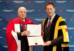 Defence Minister Peter MacKay bestows an honourary doctorate upon U.S. warmonger Sen. John McCain at the Canadian embassy in Washington, June 18, 2013. | CP /HO-Canadian embassy