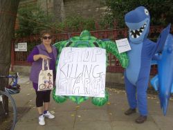 Hector the Blue Shark protesting outside the MSC