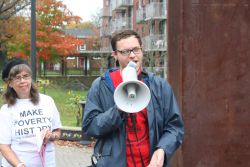 Evan Coole addresses the Eradicate Poverty Rally in October of this year.  Photo Robert DeVet