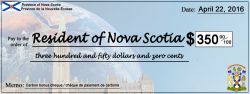 Carbon Fee and Dividend's "cheque prop" showing central feature--money returned to Nova Scotians from fees collected on pricing carbon. 
