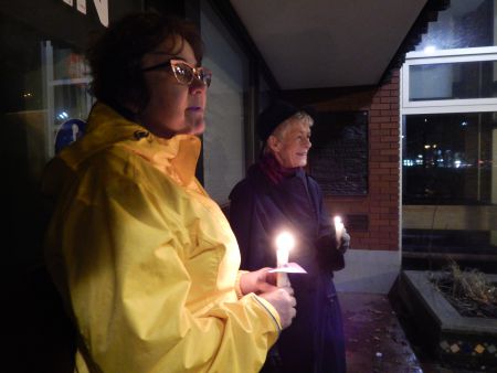  Heavy rains on Saturday night moved the candle lit vigil inside but two volunteers kept their candles burning over Gottingen Street.