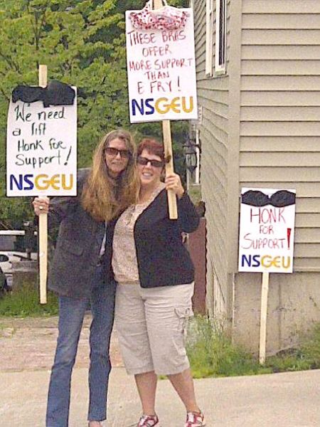 From the website of NSGEU Local 68: "NSGEU Local 68 members Heather McKenzie (left) and Lynn Yetman take time out on their lunch break on Wednesday, June 27, to call for fairer treatment by their employer, the Elizabeth Fry Society of Mainland Nova Scotia."