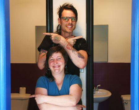 Carol and Jeff Outside the Gender Neutral Good Food Emporium Bathrooms. [Photo: Miles Howe]