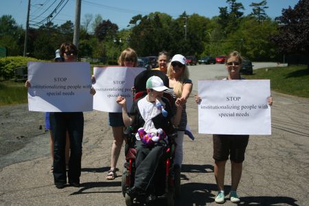 Between 30 and 40 people rallied at Lower Sackville's Quest Rehabilitation Centre to call for the speedy closure of institutions for people with intellectual disabilities.  Rallies like this one occurred all over Nova Scotia. Photo Robert Devet