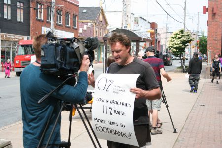 Kendall Worth fought the Community Services decision to disallow his special diet all the way to the Nova Scotia Supreme Court. Here he can be seen explaining the issue to the press during a recent anti-poverty rally in Halifax. Photo Robert Devet