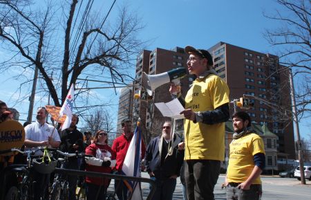 A Just Us! employee who says he was unfairly dismissed speaks at a rally in early April. (Photo by Hilary Beaumont)
