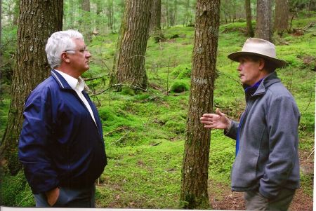 Jim Dresher, sustainable woodlot operator, discusses forestry with Nova Scotia's Minister of the Environment Sterling Belliveau in 2009. The minister spoke at NSEN's 2009 AFG, held at Dresher's Windhorse Farm.
