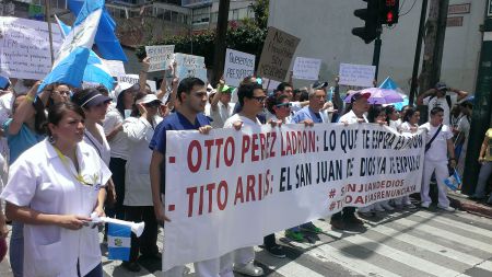 Nurses and Doctors March in the National Strike: Otto Perez Thief - Jail is Waiting for You. Tito Arias - You're Not Welcome in Our Hospital