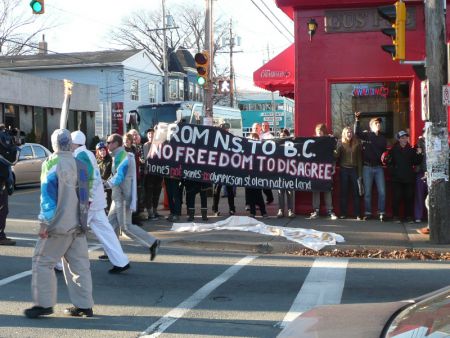 Protesters shouted "Shame" as the torch relay went down Agricola St. in Halifax.