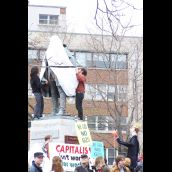 Protesters shroud the statue of Cornwallis as the Harper effigy looks on...
