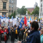 Joan Jessome, president of the NSGEU, addresses the crowd from the steps of Province House. Photo Robert Devet