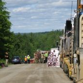 Residents of Stanley and supporters from as far away as northeastern New Brunswick block seismic vibrators upon discovering their activity on roads in Stanley, NB. Photo: Tracy Glynn. 