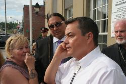 AFN Chief Shawn Atleo speaks to Elsipogtog Chief Aaren Sock on the phone, and promises a July 1st meeting [Photo: Miles Howe]
